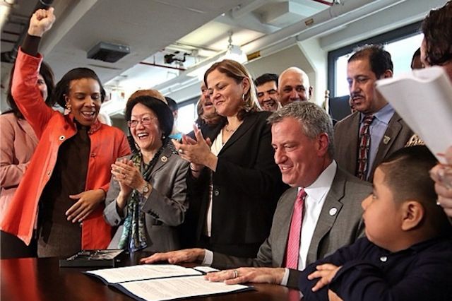 Mayor de Blasio signing the Paid Sick Leave bill earlier this year, courtesy @rachelnoerd